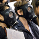 Protestors wearing gas masks attend a hearing over the Aliso Canyon gas leak on January 16th. Image Credit: Richard Vogel / AP